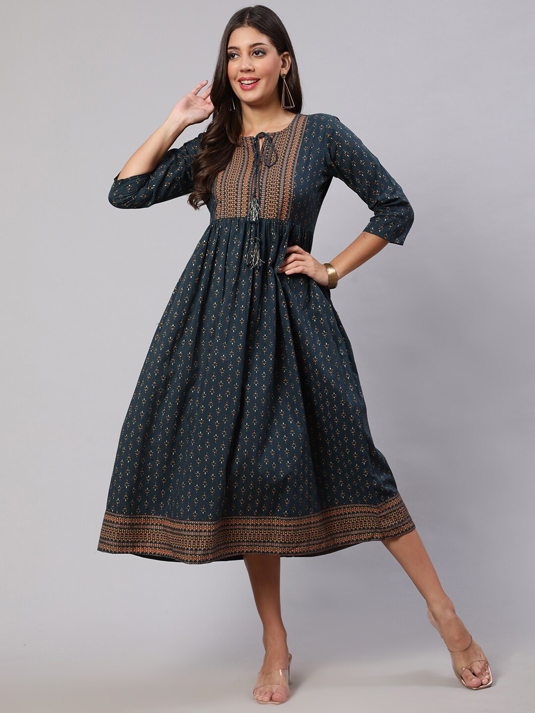 

Nayo Teal Ethnic Motifs Printed Tie-Up Neck A-Line Midi Ethnic Dress