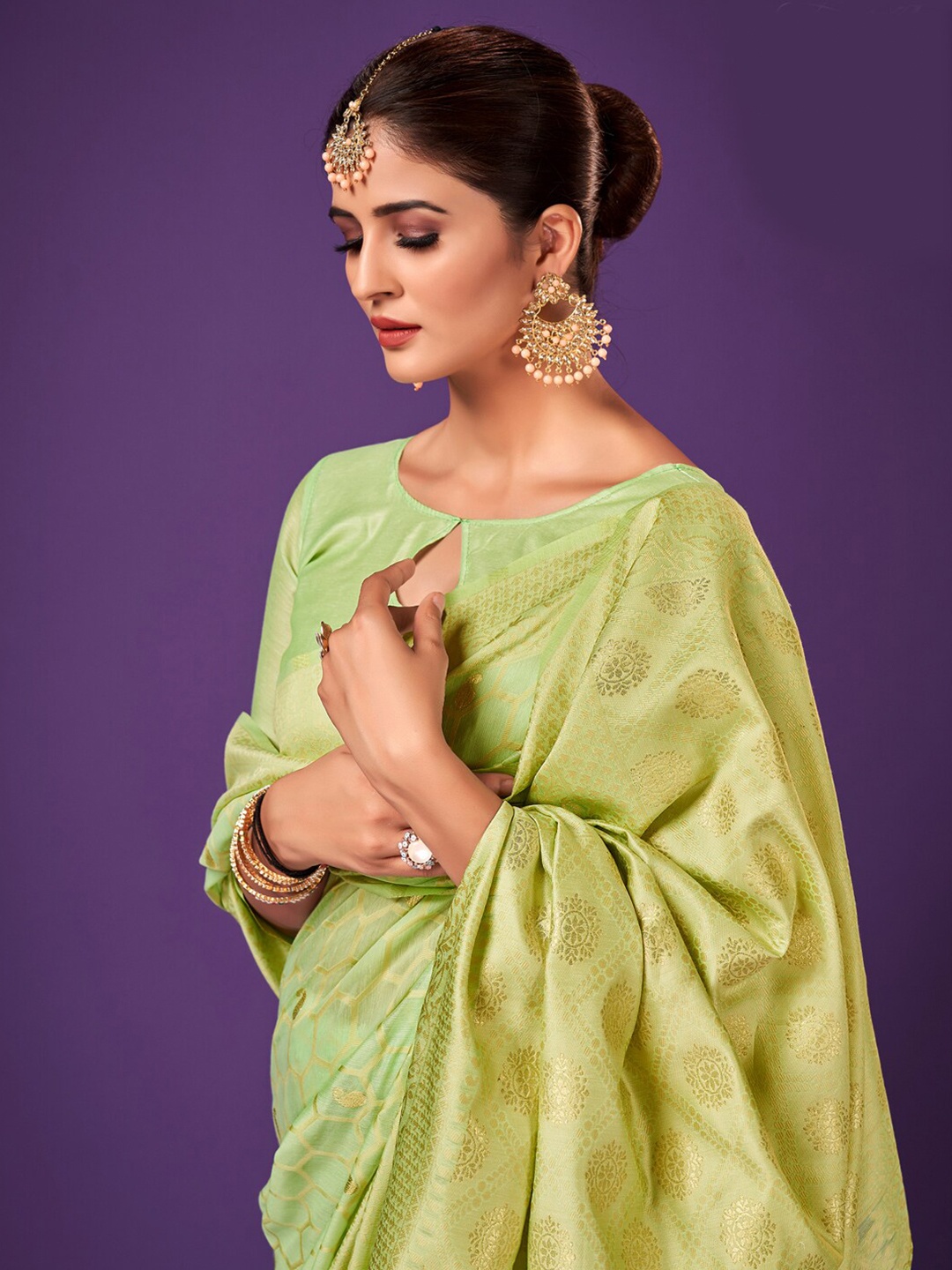 

Sangria Green Paisley Woven Design Zari Saree