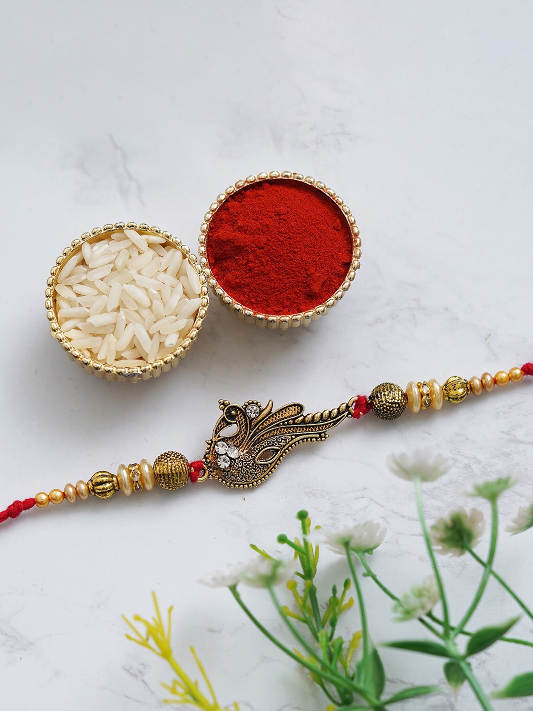 

Fashion Bizz Stone-Studded Rakhi Comes With Roli & Chawal, Metallic