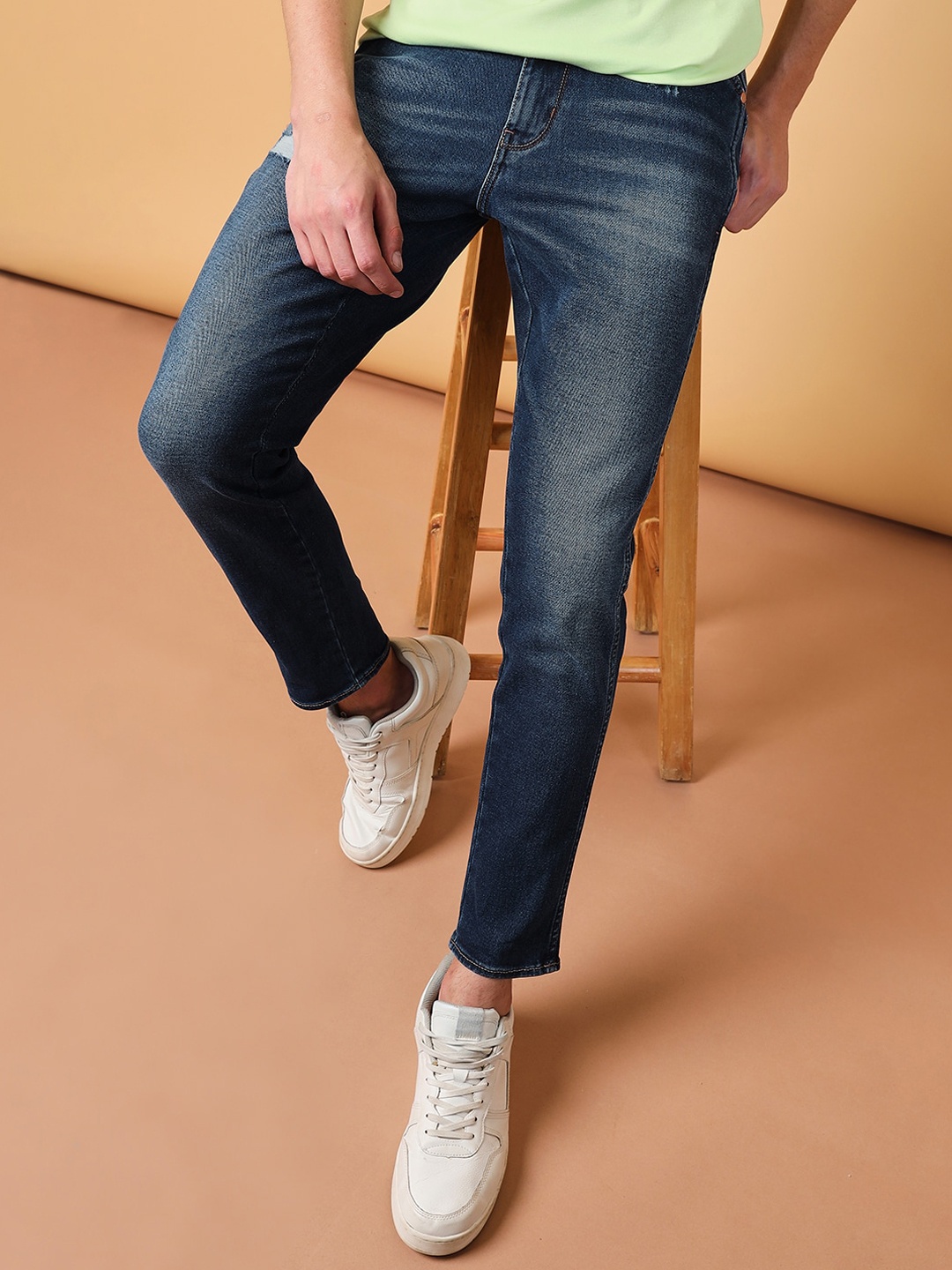 

Wrangler Men Tapered Fit Low Distress Light Fade Stretchable Jeans, Blue
