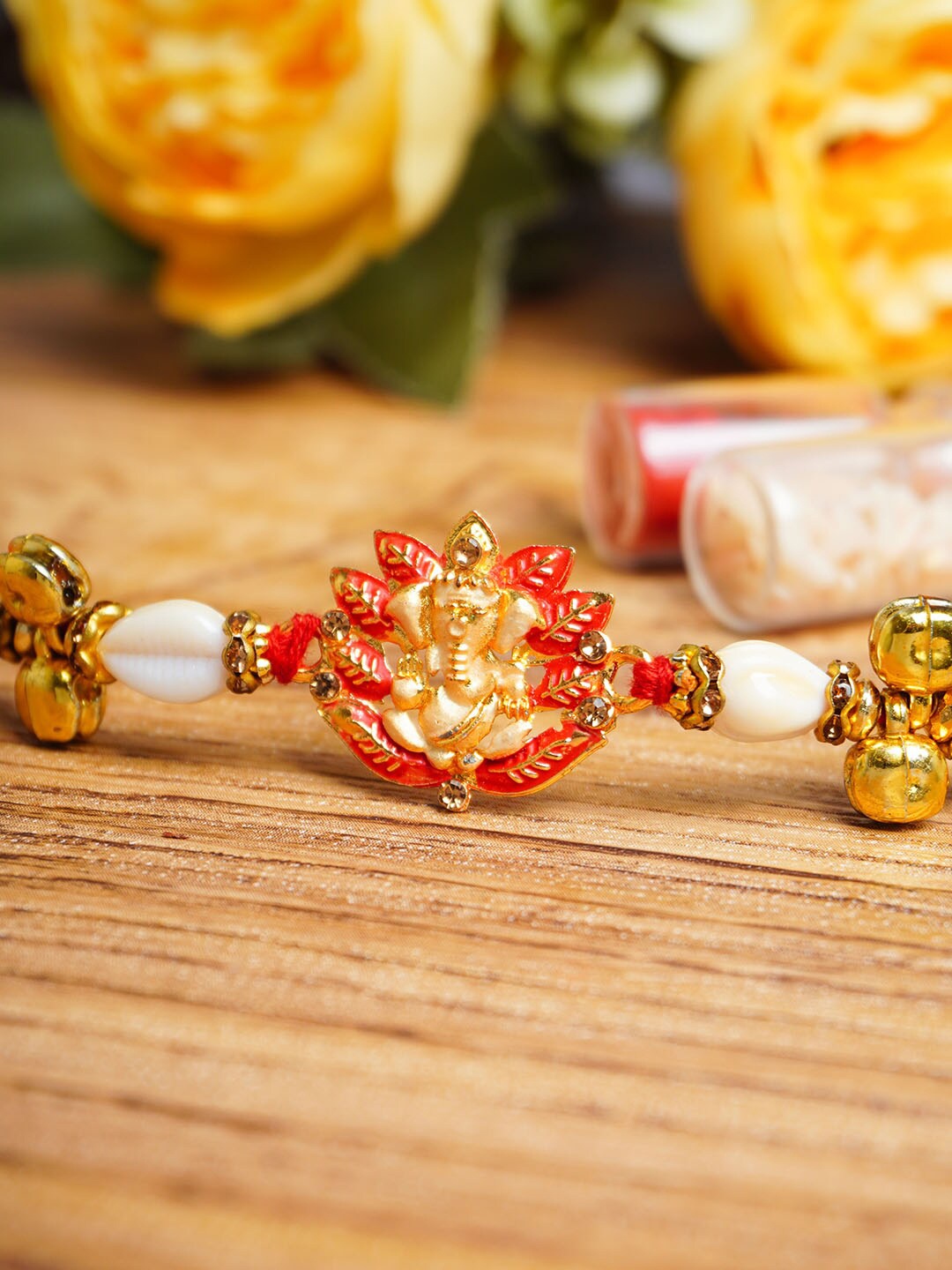 

Urmika Ganesh Charm Detail Rakhi With Roli Chawal, Red
