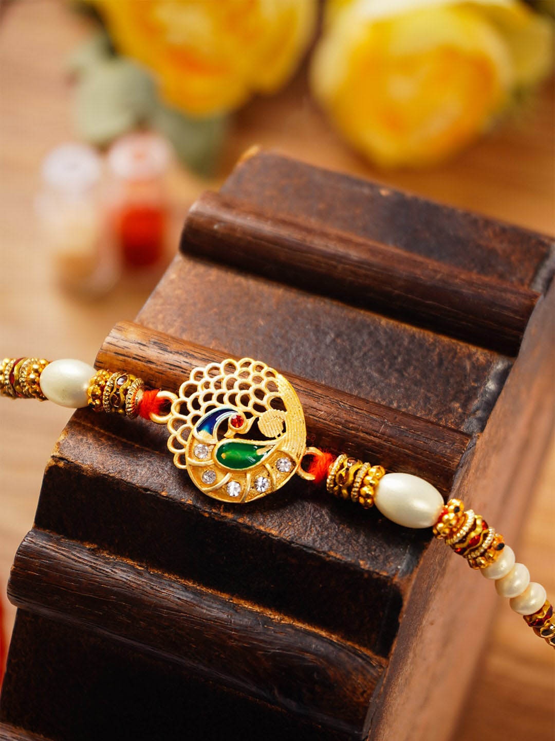 

Urmika Peacock Charm Rakhi With Roli Chawal, Gold