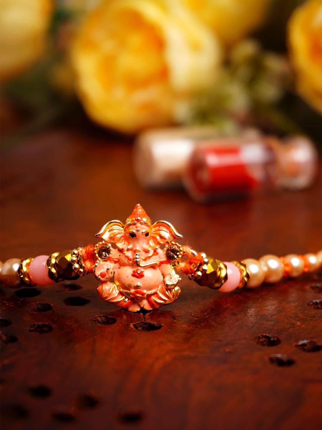 

Urmika Ganesh Beaded Rakhi With Roli Chawal, Gold