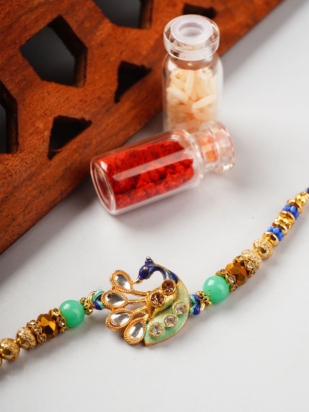 

Urmika Peacock Charm Detail Rakhi With Roli & Chawal, Green