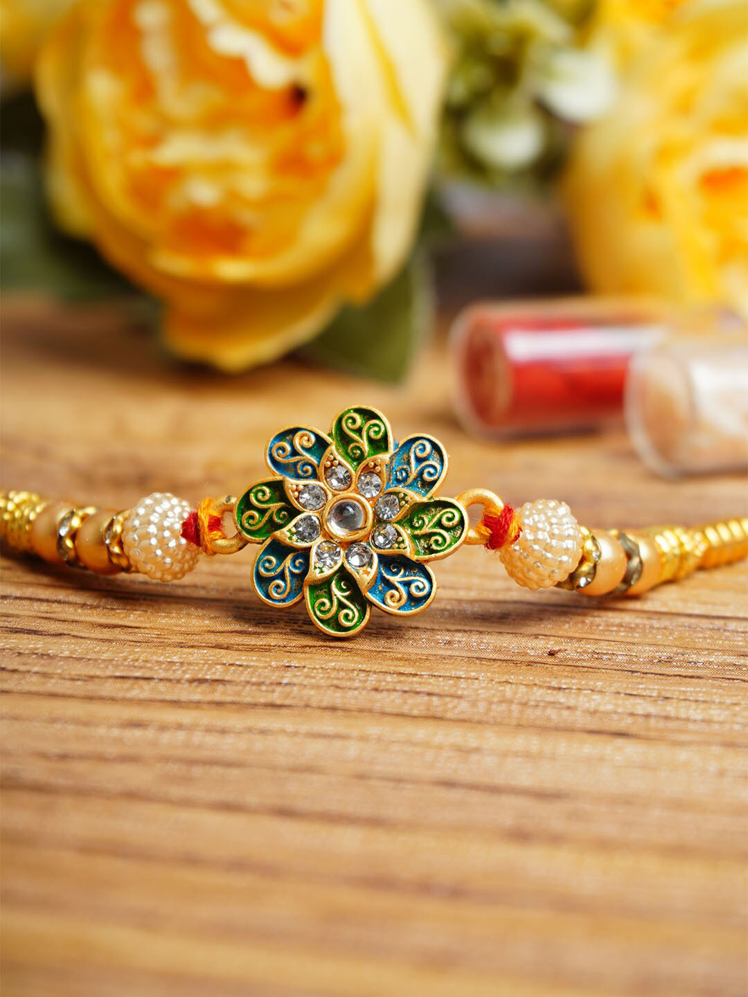 

Urmika Flower Charm Thread Rakhi With Roli Chawal, Blue