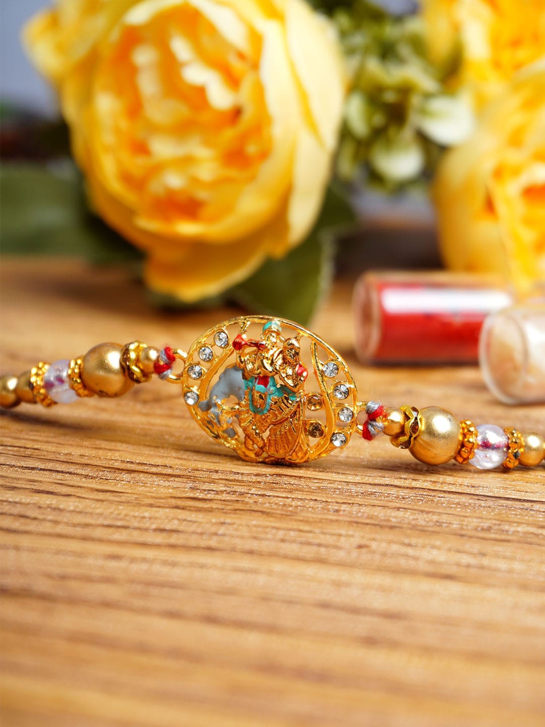 

Urmika Radha Krishna Charm Rakhi With Roli Chawal, Gold