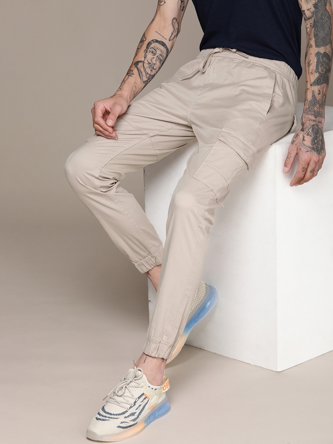 

WROGN Men Solid Mid Rise Regular Fit Cargo Style Joggers, Beige