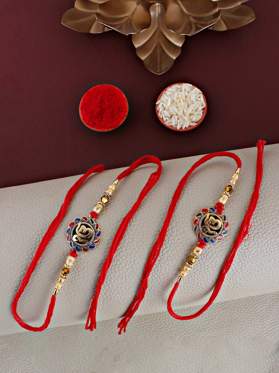 

LUCKY JEWELLERY Set Of 2 Ek Omkar Charm Rakhi With Roli Chawal & Greeting Card, Gold