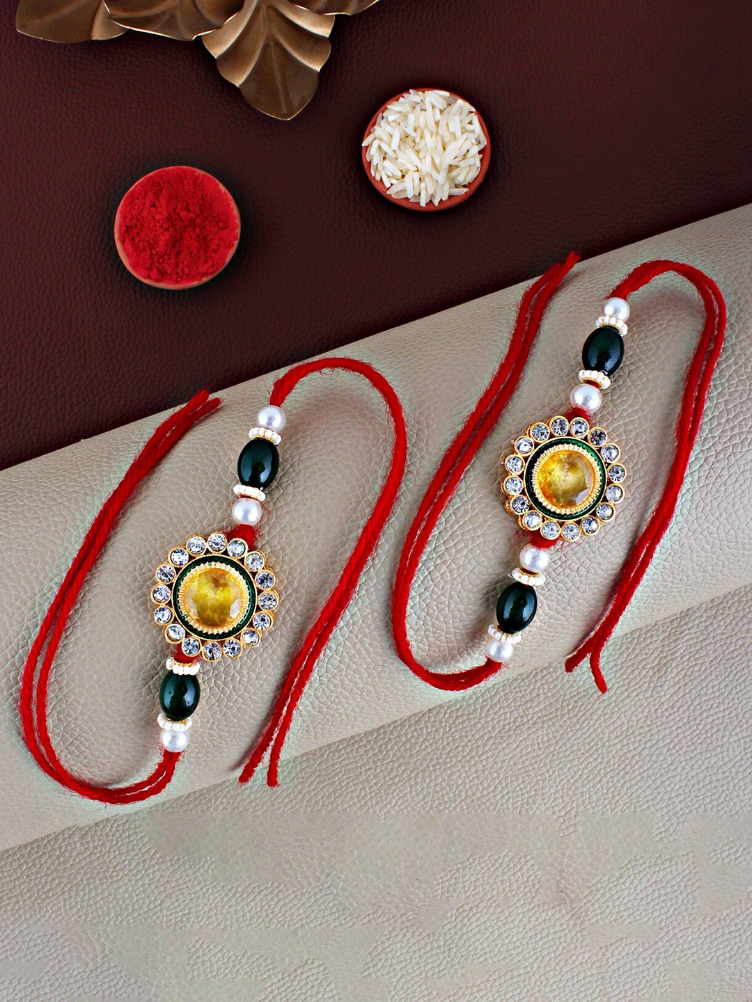 

LUCKY JEWELLERY Set Of 2 CZ-Studded Rakhis With Roli Chawal, Yellow