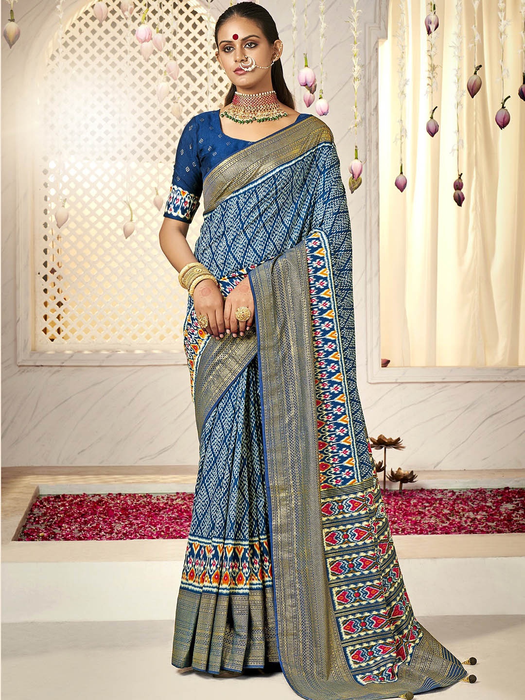 

Mitera Blue & White Ethnic Motifs Zari Silk Cotton Ikat Saree