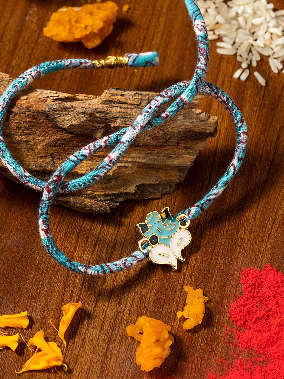 

nat Habit Ganesha Charm Rakhi With Roli Chawal, Blue