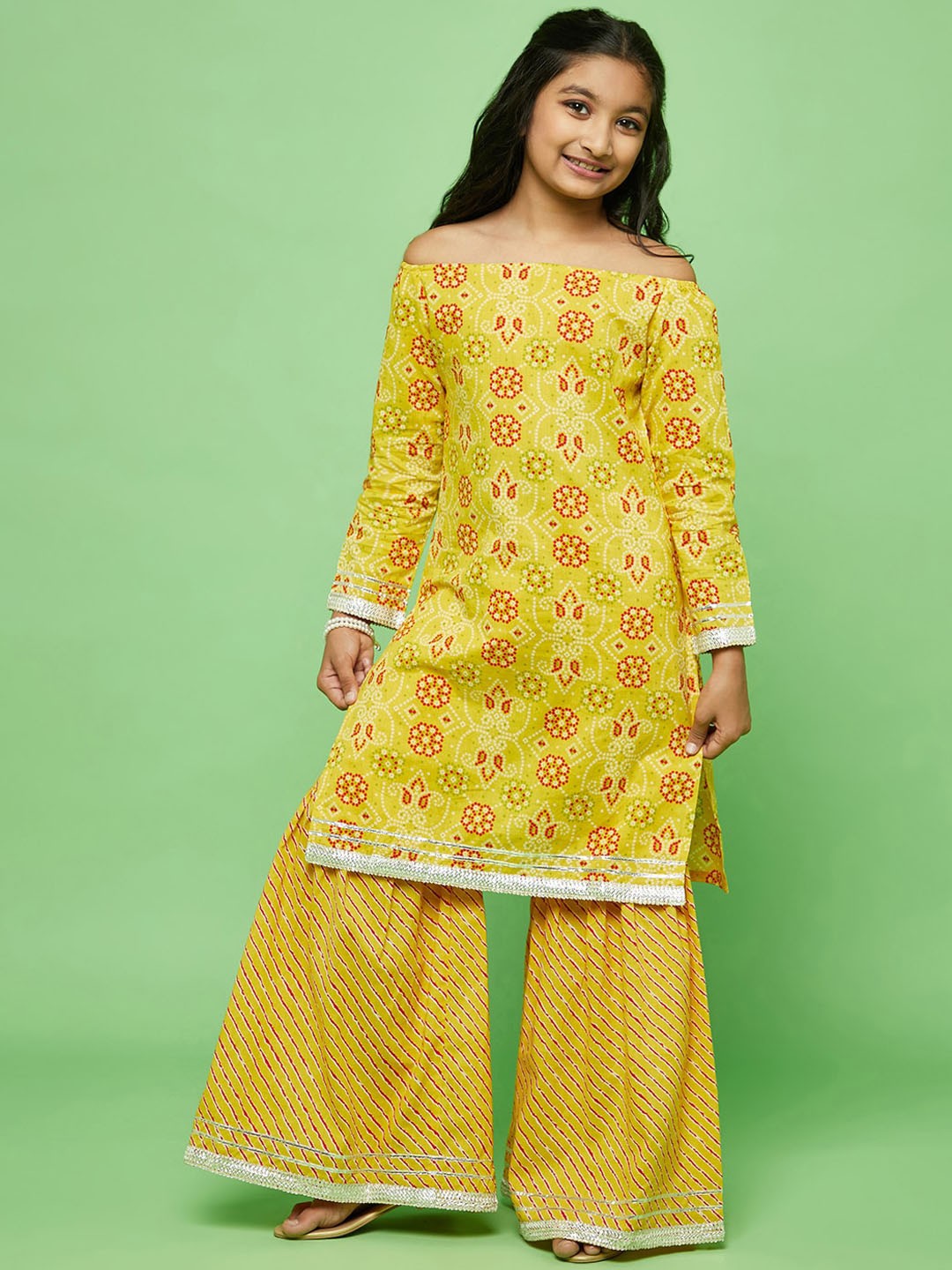 

Aks Kids Girls Bandhani Printed Off-Shoulder Regular Gotta Patti Cotton Kurta With Sharara, Yellow