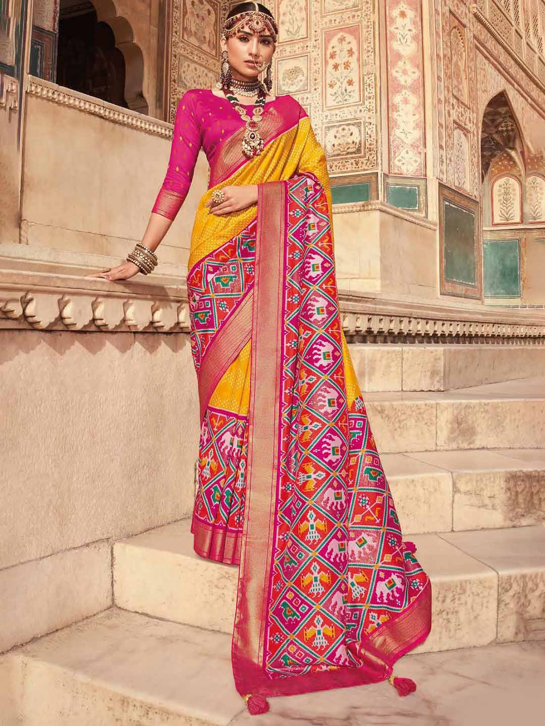 

Mitera Yellow & Pink Ethnic Motifs Printed Zari Patola Saree