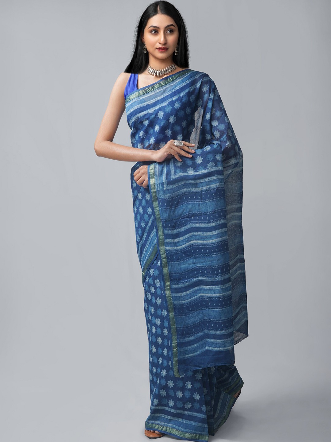 

Unnati Silks Blue & White Ethnic Motifs Zari Pure Cotton Handloom Dabu Saree