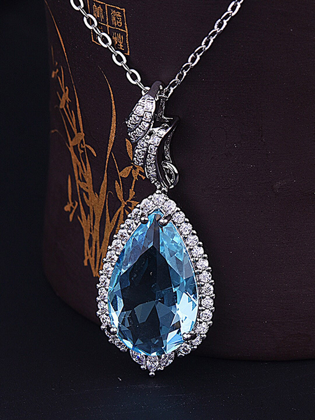 

Designs & You Silver-Plated American Diamond Studded Teardrop Shaped Pendant