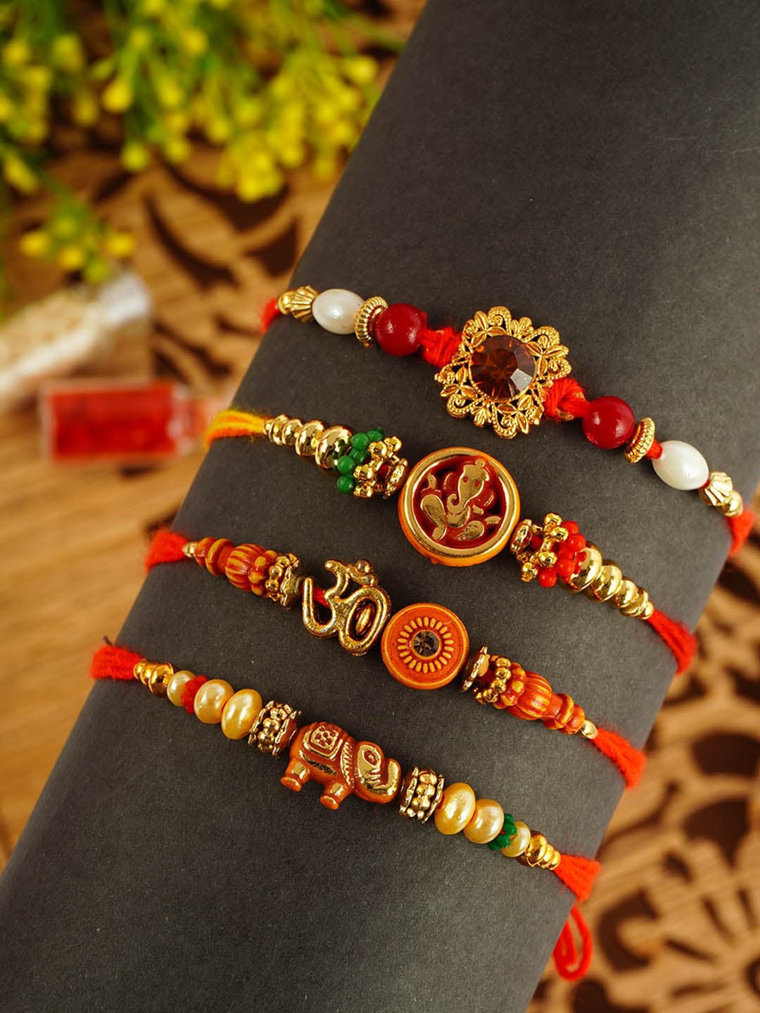 

Urmika Set Of 4 Beaded Thread Rakhis, Red