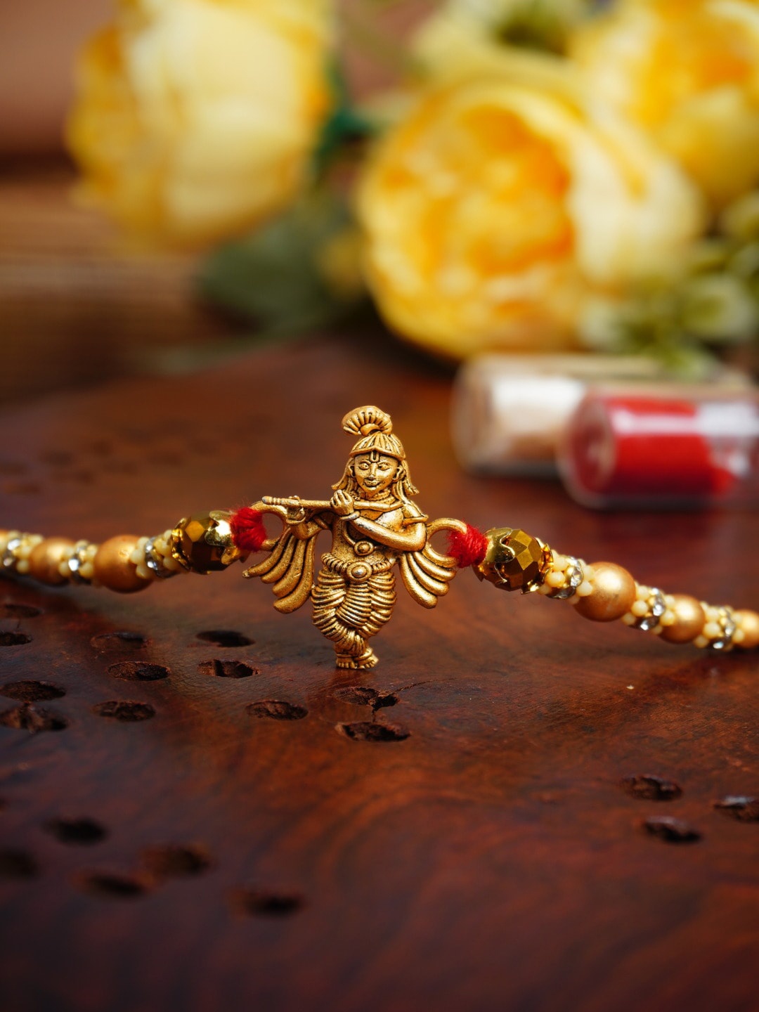 

Urmika Krishna Thread Rakhi, Gold