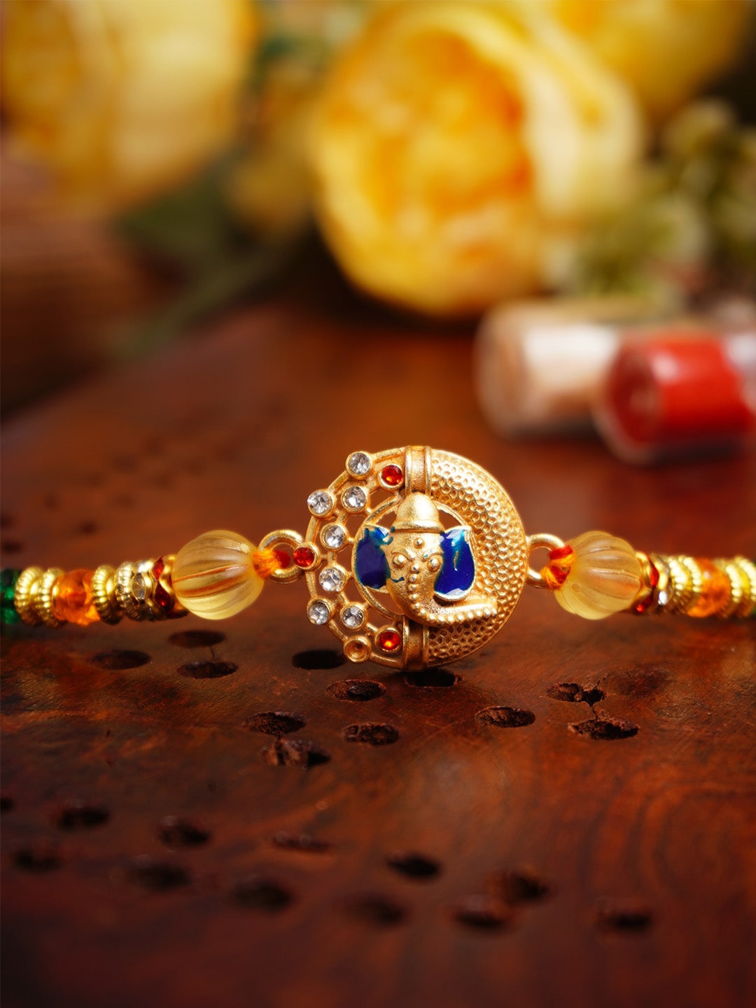 

Urmika Ganesh Thread Rakhi with Roli Chawal, Gold