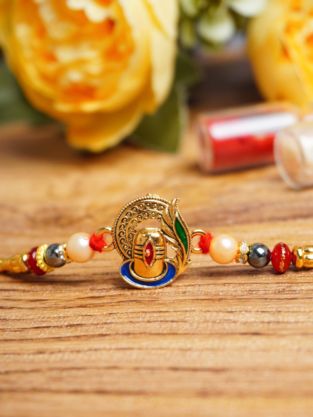 

Urmika Unisex Antique Shivling Rakhi With Roli Chawal, Gold