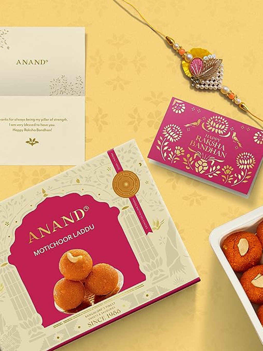 

ANAND Studded Rakhi With Motichur Laddu Sweets Gift Set- 250 Gms, Yellow