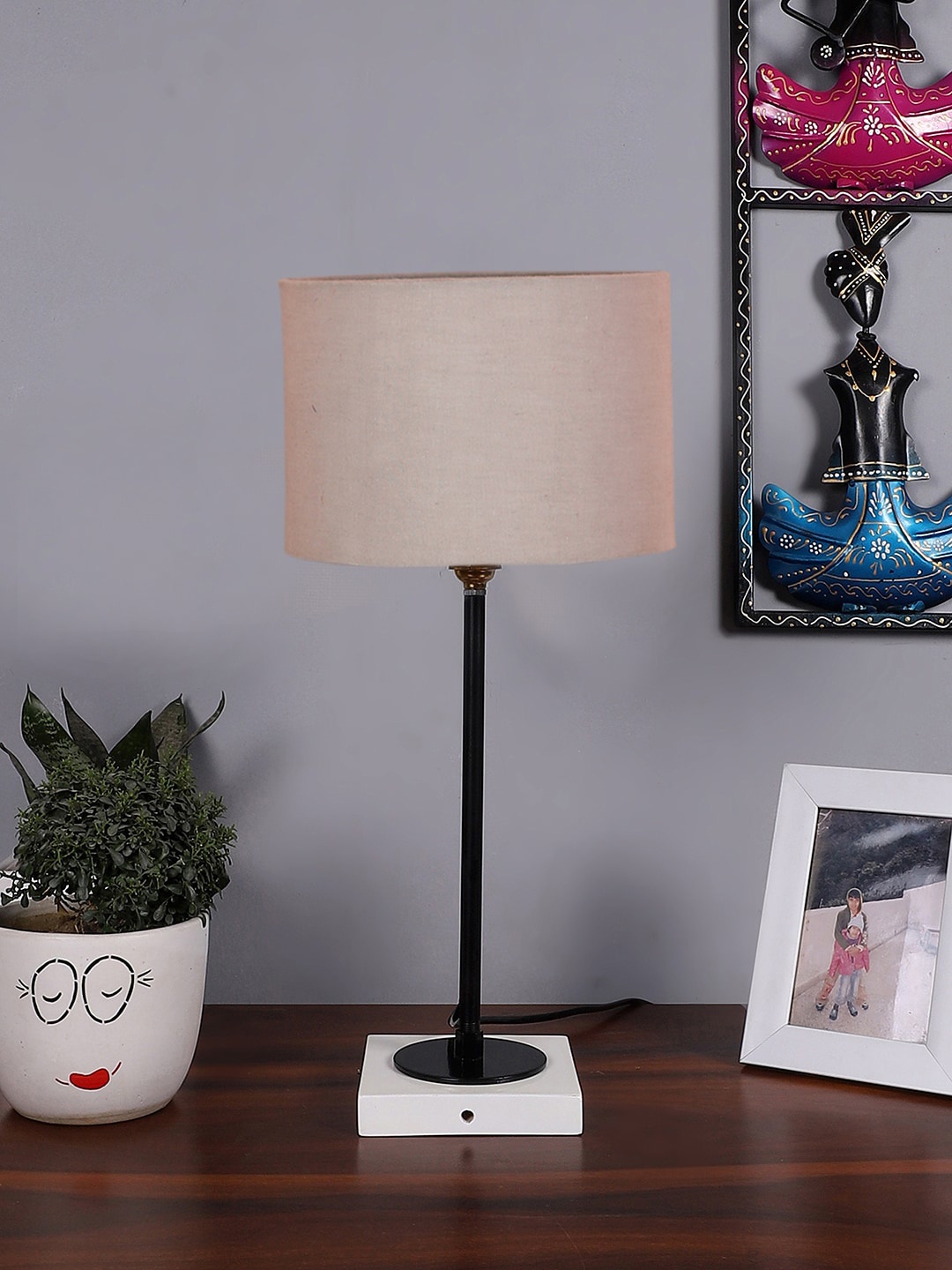 

Devansh Grey Wood Round Shaped Table Lamp