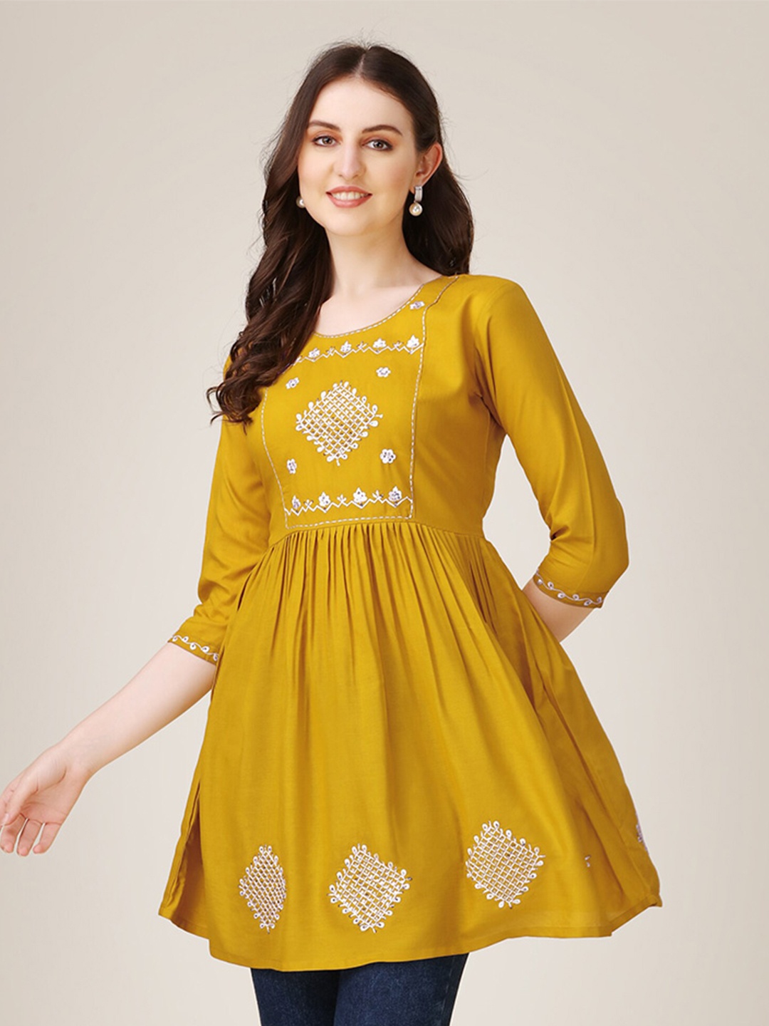 

Vaidehi Fashion Embroidered Work Three-Quarter Sleeves Tunic, Mustard
