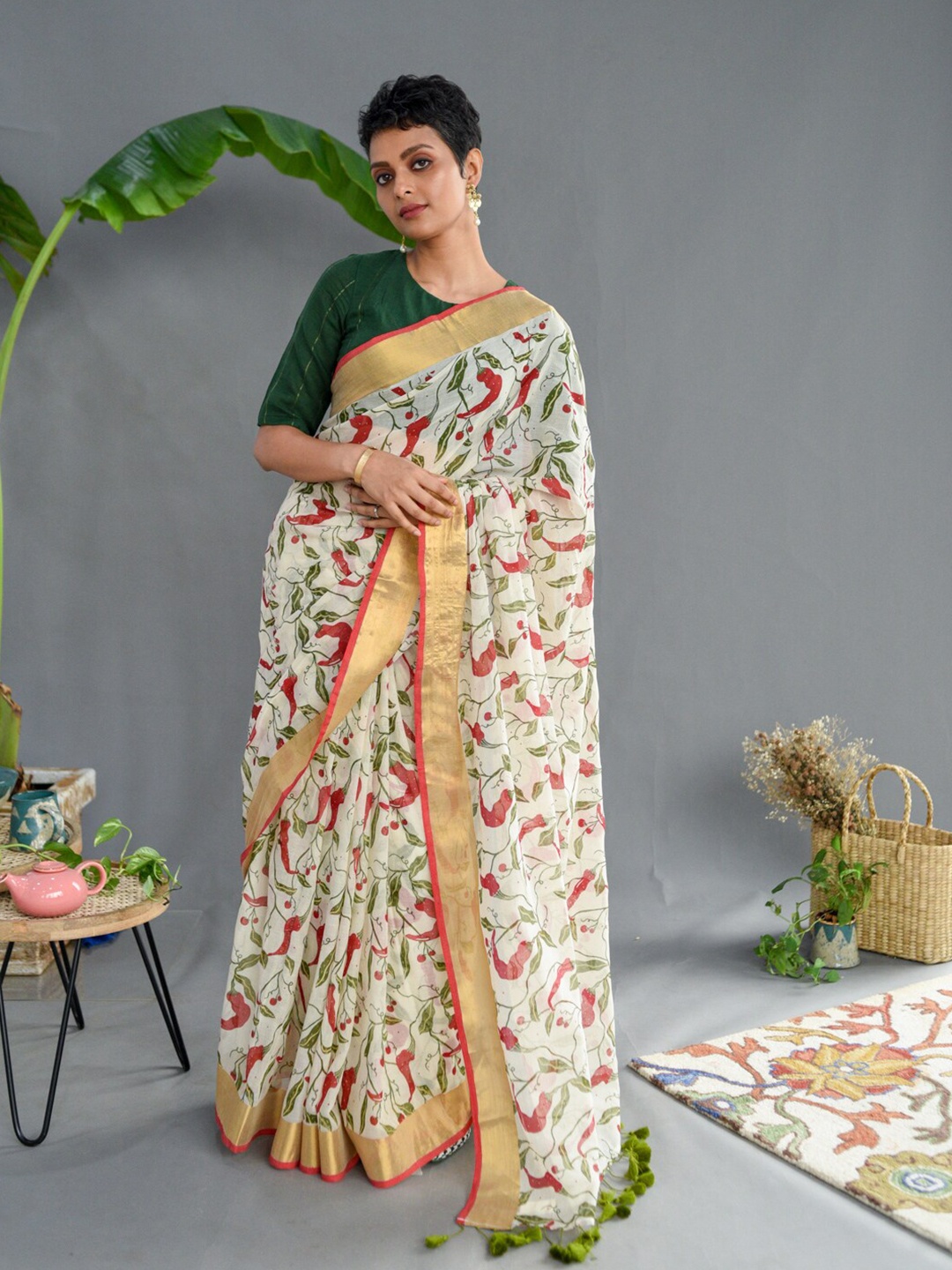 

Suta White & Green Floral Printed Zari Pure Cotton Saree