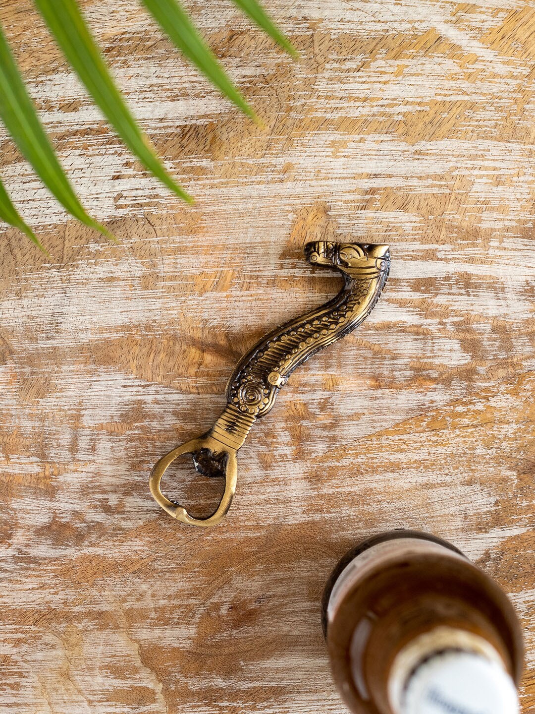 

ExclusiveLane Beige & Green Seahorse Enamelled Brass Bottle Opener