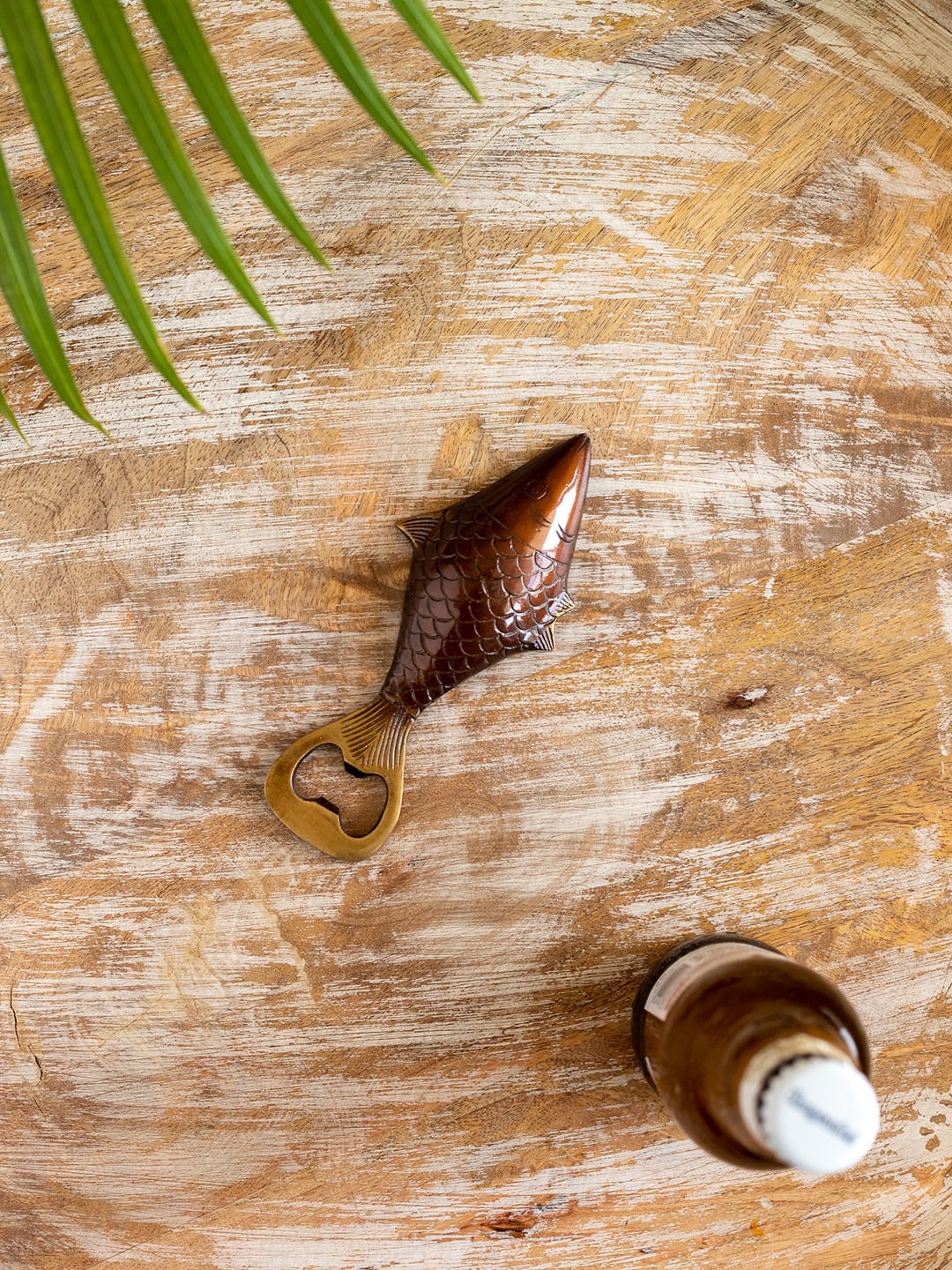 

ExclusiveLane Beige & Maroon Gold Fish Brass Bottle Opener