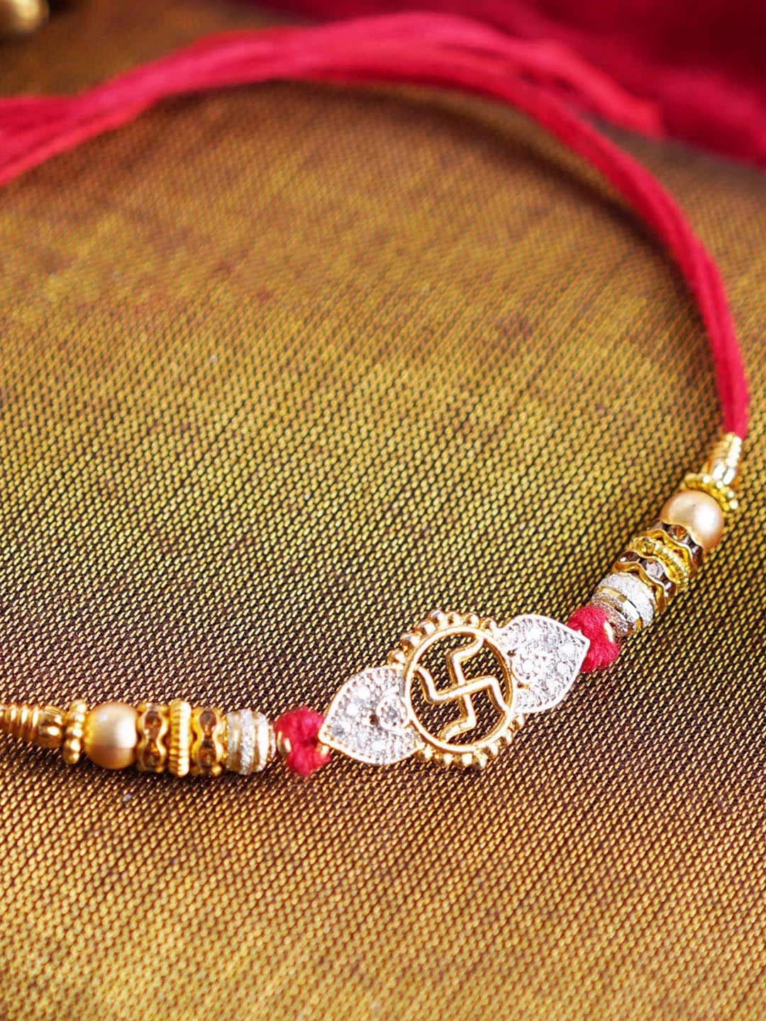 

TIED RIBBONS Men Swatik Thread Rakhi With Roli chawal & Greeting card, Gold