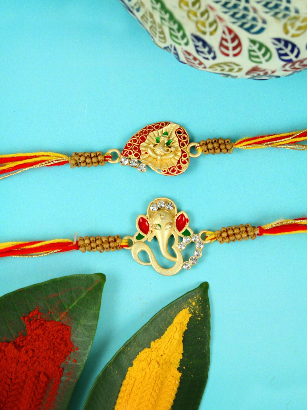 

TIED RIBBONS Set Of 2 Ganesha Charm Rakhis, Red