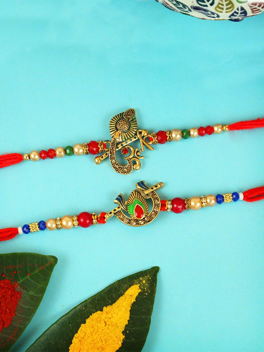 

TIED RIBBONS Set Of 2 Ganesha & Flute Charm Rakhi with Card, Red