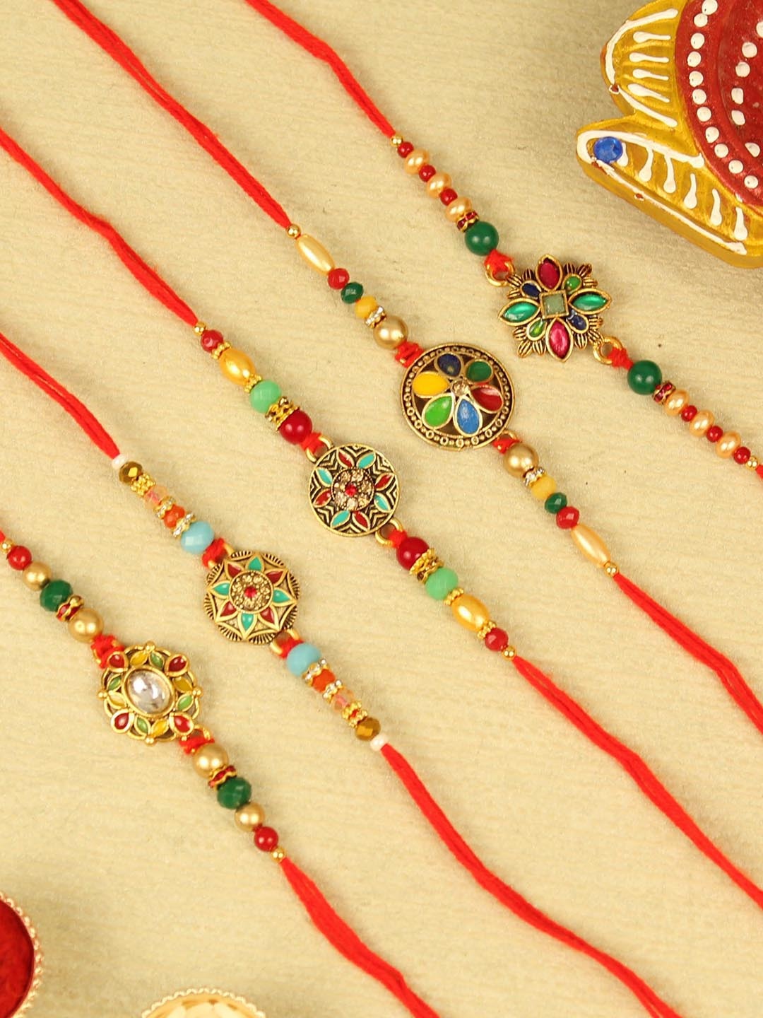 

TIED RIBBONS Set Of 5 Rakhi With Roli Chawal & Card, Red