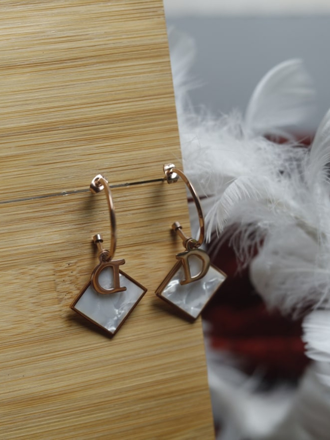 

Maansh Rose Gold Plated Stainless Steel Contemporary Drop Earrings