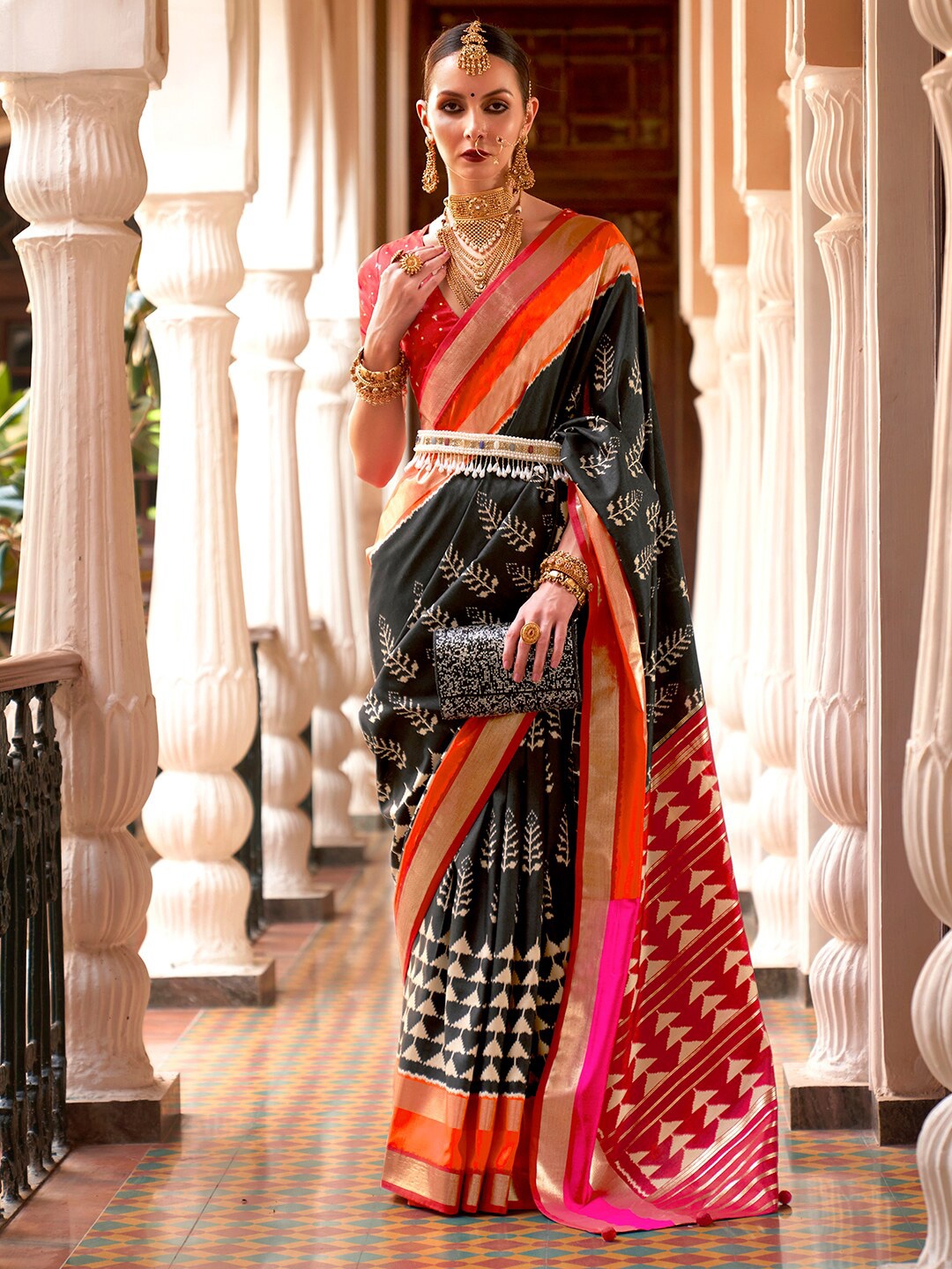 

Anouk Black & Red Ethnic Motifs Printed Zari Ikat Saree