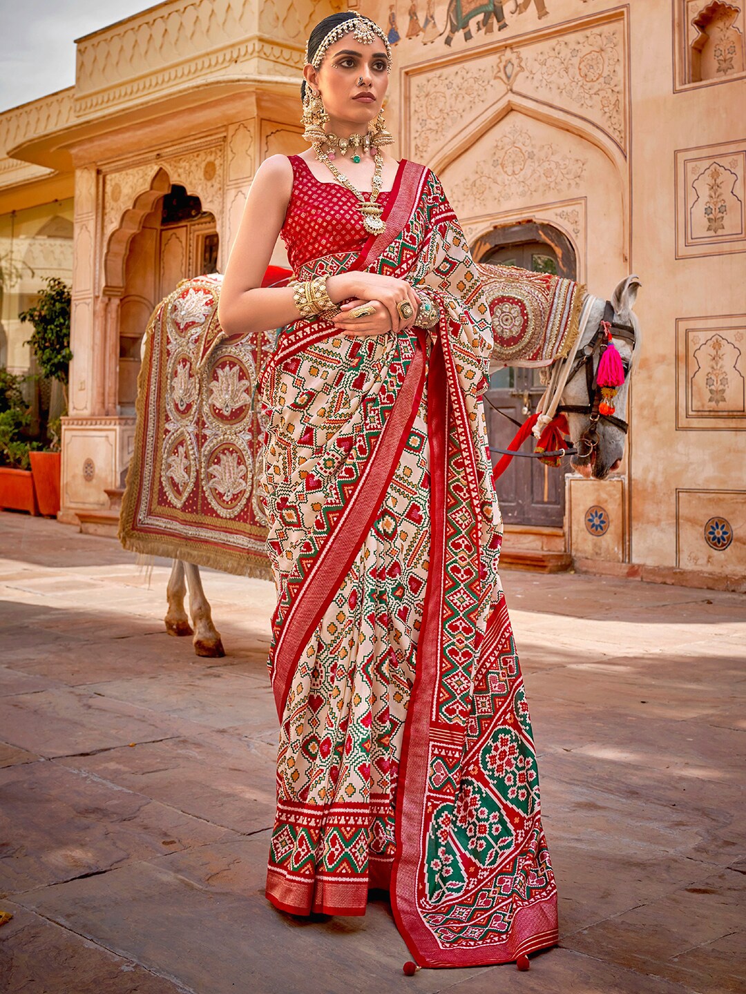 

Anouk Cream-Coloured & Red Ethnic Motifs Printed Zari Patola Saree