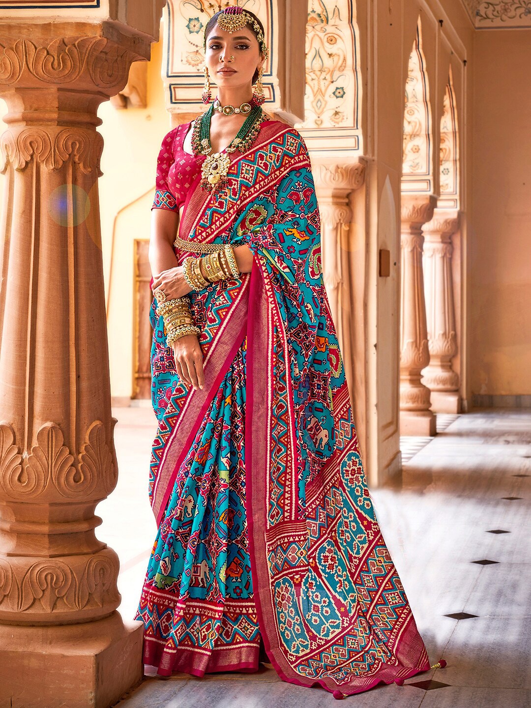 

Anouk Blue & Gold-Toned Ethnic Motifs Printed Zari Patola Saree