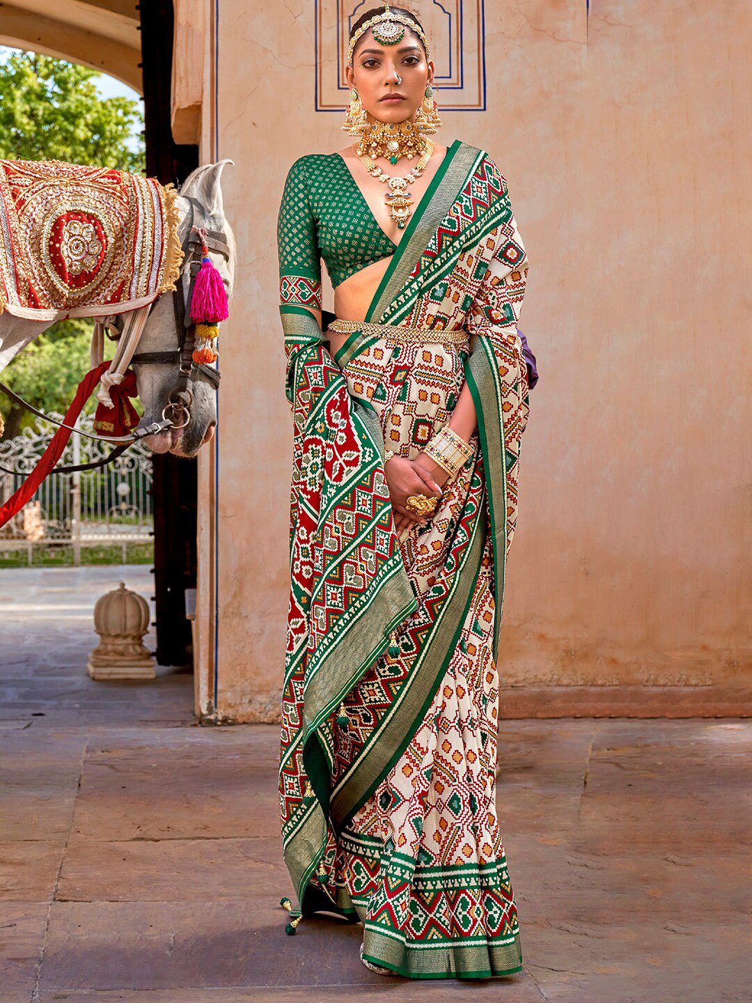 

Anouk Cream-Coloured & Red Ethnic Motifs Printed Zari Patola Saree