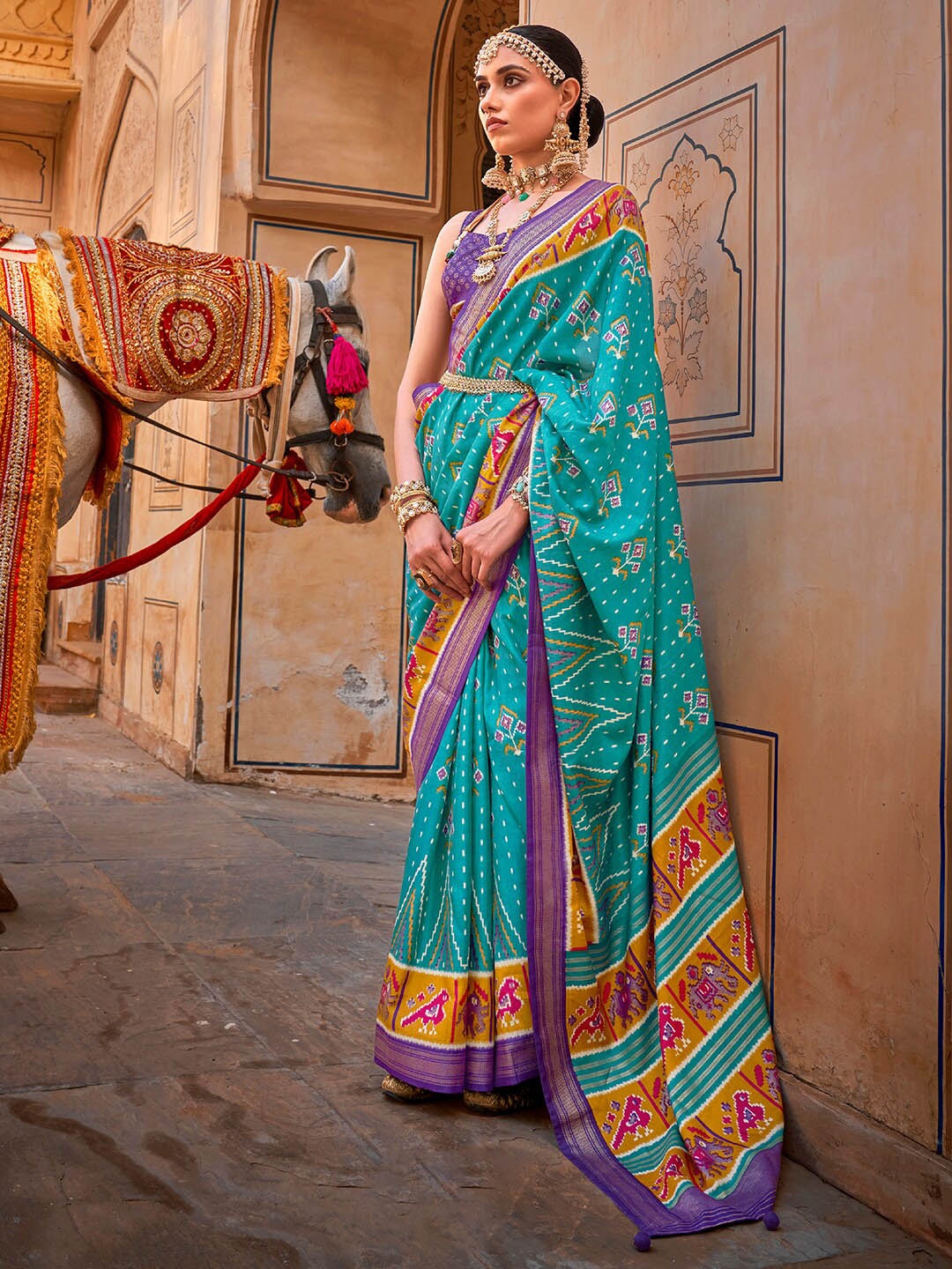 

Anouk Blue & Purple Ethnic Motifs Printed Zari Patola Saree