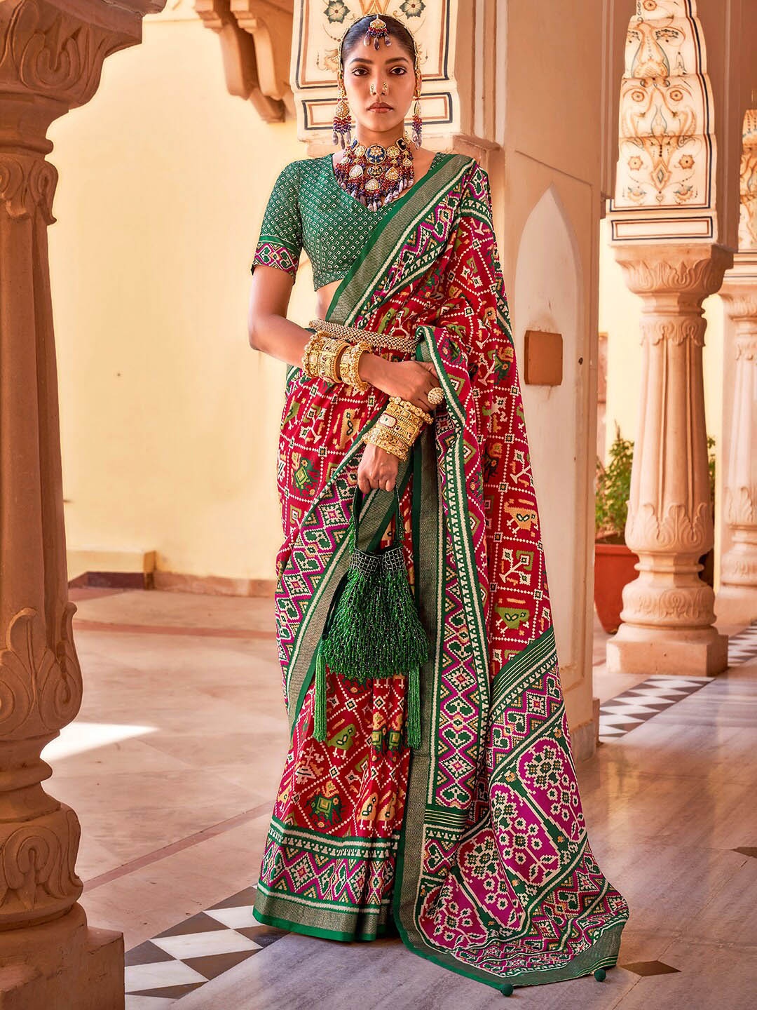 

Anouk Red & Pink Ethnic Motifs Printed Zari Patola Saree