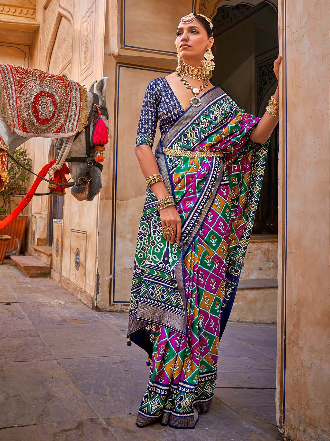 

Anouk Ethnic Motifs Woven Design Zari Patola Saree, Navy blue