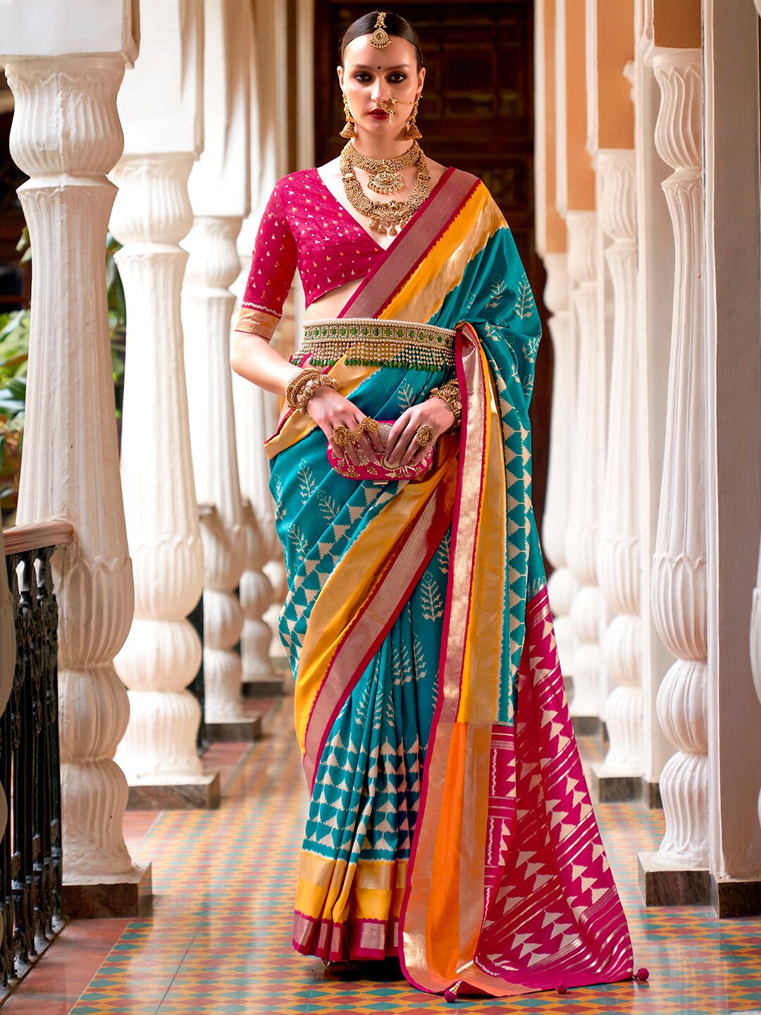 

Anouk Blue & Pink Ethnic Motifs Printed Zari Ikat Saree