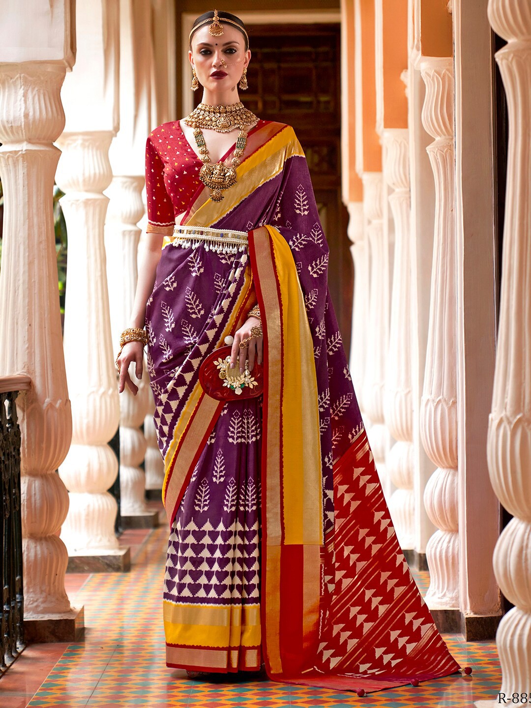 

Anouk Purple & Red Ethnic Motifs Printed Zari Ikat Saree
