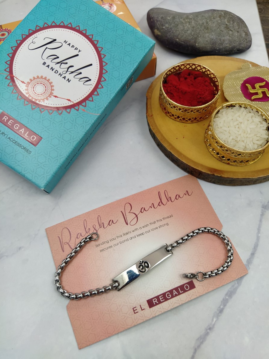 

EL REGALO Men Om Charm Stainless Steel Rakhi With Roli Chawal & Greeting Card, Silver