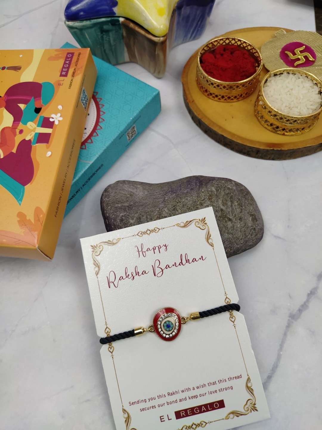 

EL REGALO Men Evil Eye Rakhi With Greeting Card & Roli Chawal, Red
