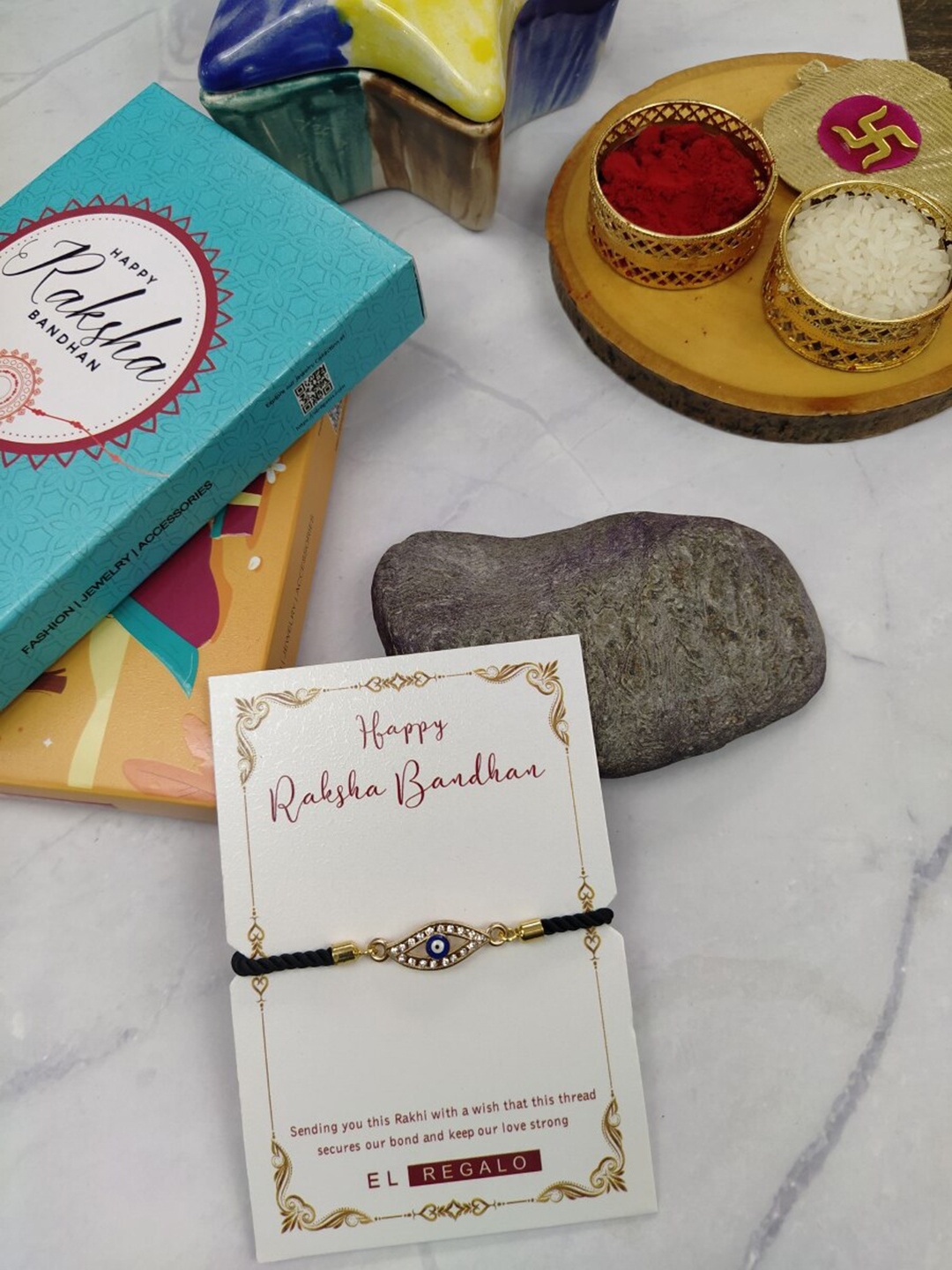 

EL REGALO Men Stone Studded Evil Eye Rakhi With Roli Chawal & Greeting Card, Gold