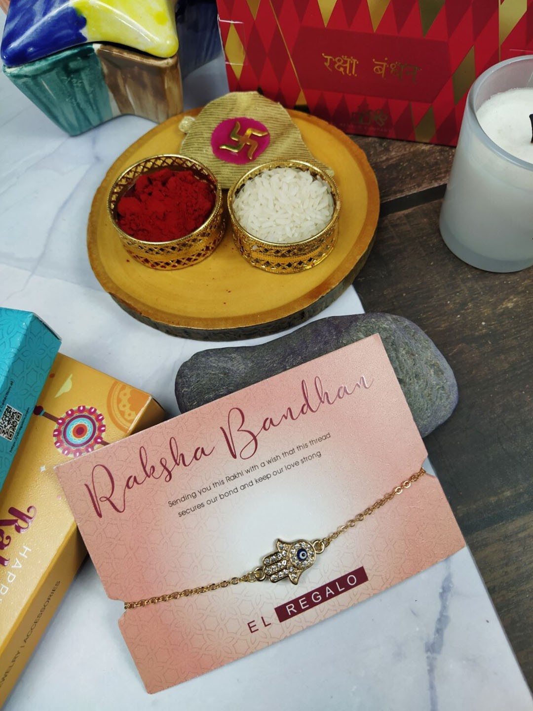

EL REGALO Men Stone-studded Evil Eye Hamsa Rakhi With Greeting Card & Roli Chawal, Gold