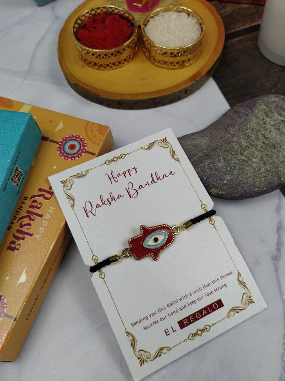 

EL REGALO Men Evil Eye Rakhi With Roli Chawal & Greeting Card, Gold