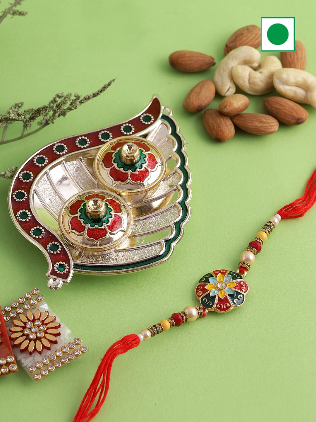 

Aapno Rajasthan Leaf Roli Chawal Thali And Almonds Cashews With Bhaiya Rakhi 100gm each, Gold