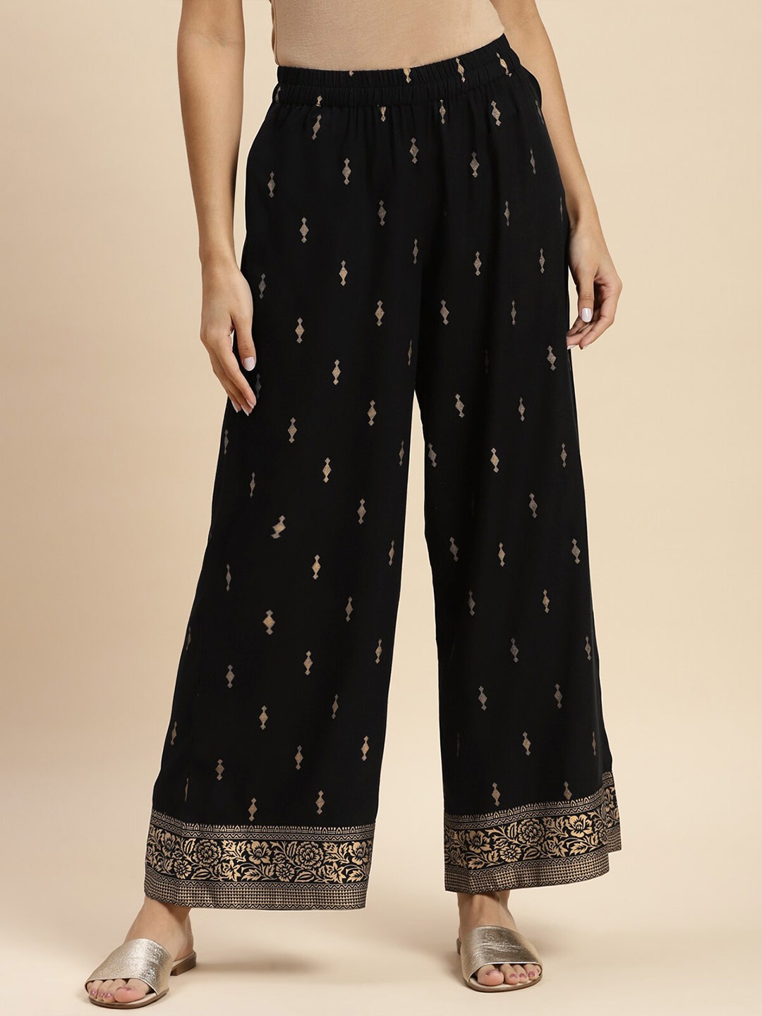 

Rangita Women Ethnic Motifs Printed Flared Ethnic Palazzos, Black